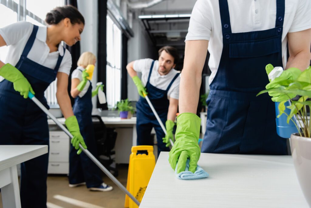 167240429_m Professional cleaning crew cleaning an office